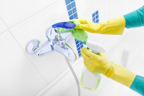 Supervisor checking notes during a cleaning service review